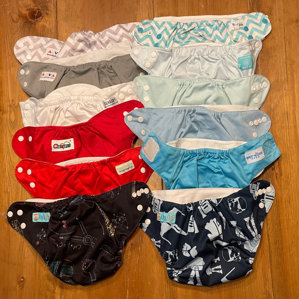 Lot of 12 miscellaneous brand pocket diapers